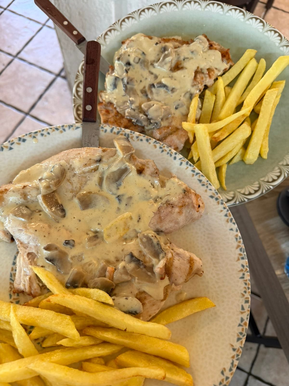 Chicken fillet ala cream with mushroom sauce and fries at Taverna Xarama